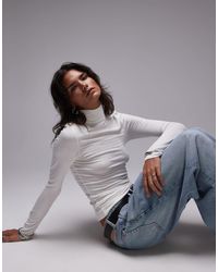 TOPSHOP - Top côtelé à manches longues et col cheminée - Lyst