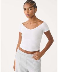 Stradivarius - T-Shirt Bianca A Coste Con Scollo A V - Lyst