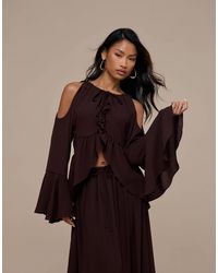 Wanderdoll - Meadow neckholder-top mit langen ärmeln aus chiffon als kombiteil - Lyst
