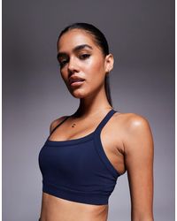4505 - Icon Medium Support Square Neck Sports Bra With Adjustable Straps - Lyst