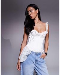 Oh Polly - Caelie 3d Floral Applique Ruffle Playsuit - Lyst