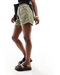 New Look - Pantalones cortos vaqueros oscuro con cinturilla paperbarg - Lyst