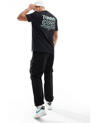 Tommy Hilfiger - T-shirt nera vestibilità classica con logo fluo 1985 - Lyst