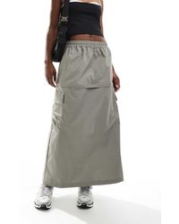 Nike - Sportswear Essential Mid-Rise Woven Cargo Midi Skirt - Lyst