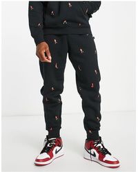 nike black essentials slim trackies