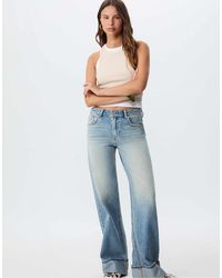 Stradivarius - – d91 – jeans aus mittelhellem denim mit weitem bein und niedrigem bund - Lyst