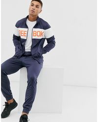 tuta reebok nera strisce bianche