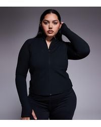 4505 - Top Deportivo De Manga Larga Con Cremallera De Tejido Suave Icon De Curve - Lyst