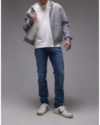 Tommy Hilfiger - Scanton - jean coupe slim - moyen délavé - Lyst