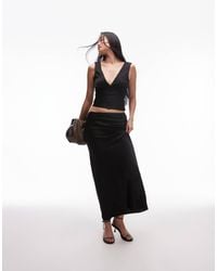 Nia - Ravello Rosette Detail Satin Maxi Skirt - Lyst