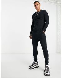 Tuta sportiva nera con felpa a maniche corte e pantaloncini slim Asos Uomo Sport & Swimwear Abbigliamento sportivo Felpe sportive 