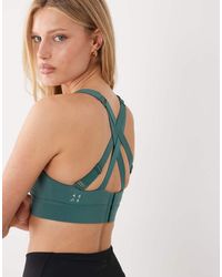 4505 - Icon Active High Support Sports Bra With Removable Padding And Adjustable Straps - Lyst