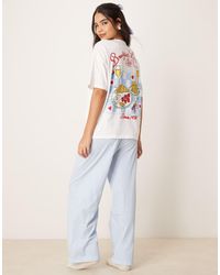 ASOS - Pyjamaset Van Oversized T-Shirt Met 'Breakfast Lovers'-Print En Broek Met Wijde Pijpen - Lyst