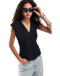 Weekday - Sleeveless Blouse Top With V Neck And Hook And Eye Corset Waist Detail - Lyst