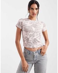 Levi's - Newspaper Graphic Baby Tee - Lyst
