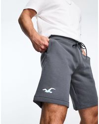 Hollister - Pantaloncini della tuta grigi da 9" con logo laminato - Lyst