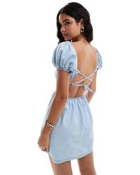 ASOS - Puff Sleeve Denim Mini Dress With Cross Back Detail - Lyst