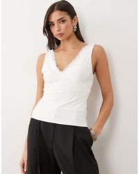 Fashionkilla - Exclusive Double Sculpted Slinky Lace Trim V Neck Vest Top - Lyst