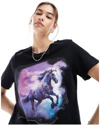 Monki - T-shirt a maniche corte nera con stampa di cavallo selvaggio sul davanti - Lyst