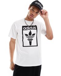adidas Originals - T-shirt bianca con grafica di torcia olimpica - Lyst