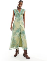 Reclaimed (vintage) - Vestido midi verde con estampado floral y ribete - Lyst