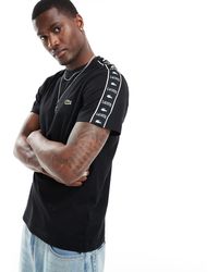 Lacoste - T-shirt a maniche corte nera con fettuccia - Lyst