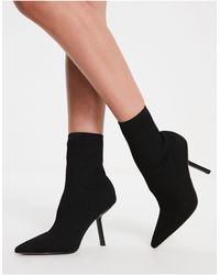 ASOS - Botas negras estilo calcetín con tacón - Lyst