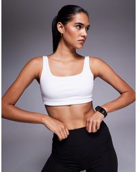 4505 - Medium Support Running Bra With Removable Padding - Lyst