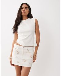 Mango - Mini-jupe en denim 100 % coton à broderies - Lyst