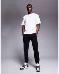 ARMANI EXCHANGE - Logo Cuffed Joggers - Lyst