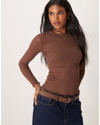 Vila - Top Marrón Medio Con Cuello Alto Y Detalle Ondulado En Los Bordes De Tejido Transparente De - Lyst