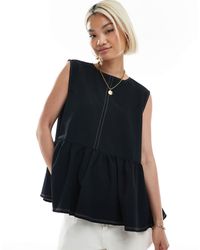 ASOS - Top sans manches avec ourlet à basque volumineuse et coutures contrastantes - Lyst