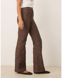 Free People - Runway Floral Flare Pants - Lyst