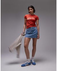 TOPSHOP - Mini-jupe en jean à basque et rayures délavées - Lyst