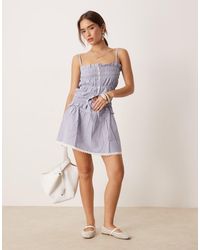 esmé studios - Esmee Exclusive Tie Front Mini Beach Skirt With Trim Detail - Lyst
