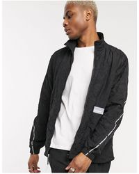 puma packable hooded jacket in black 85162101