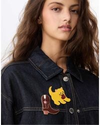 Stradivarius - – 2er-set goldfarbene anstecker mit cowboy- und katzen-design - Lyst