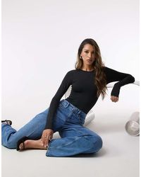 GOOD AMERICAN - Corrigerende Bodysuit Met Ronde Hals - Lyst