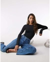 GOOD AMERICAN - Sculpting Crewneck Bodysuit - Lyst