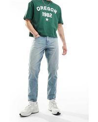 ASOS - Jeans Affusolati Lavaggio Chiaro Con Tinta Vintage - Lyst