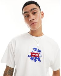 Levi's - T-shirt bianca con stampa di palme e del logo al centro e sul retro - Lyst