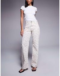 River Island - Ruimvallende Rechte Jeans Met Fijne Bloemenprint - Lyst