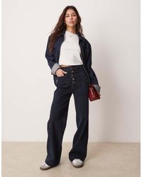ASOS - Vaqueros Negruzco De Pernera Ancha Con Bolsillos De Parche Y Detalle De Botones Dorados En La Bragueta De - Marino - Lyst