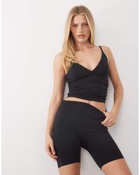 4505 - Plush Handle Ruched Side Vest With Inner Bra - Lyst