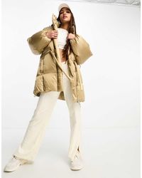 Levi's - Chaqueta De Plumón De Largo Medio Color Crema Con Capucha Y Logo Bubble De -Blanco - Lyst