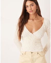 Aware - Stretchy Jacquard Knit Bell Sleeve Wrap Detail Top - Lyst