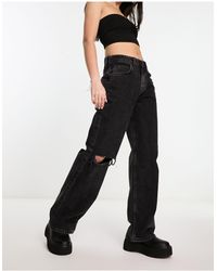 ASOS - Jeans ampi stile boyfriend nero slavato con strappi sulle ginocchia - Lyst