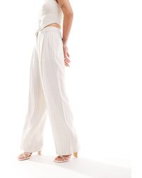 New Look - Pantaloni a fondo ampio effetto lino con motivo a righe - Lyst