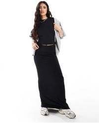 In The Style - Falda Larga Negra Ceñida Con Cinturilla Plegada Y Diseño Moldeador De Modal Fits Mix & Match De - Lyst