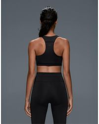 Oysho - Rapid Dry Medium Support Sports Bra With Pockets - Lyst